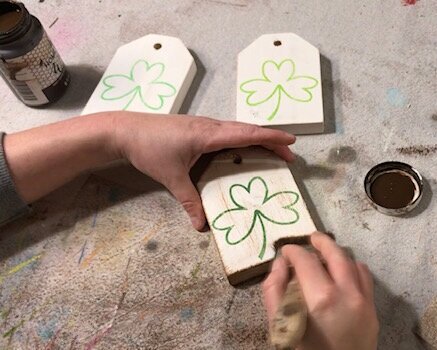 DIY craft kit for adults. How to make mini wood tags for St. Patrick's Day using your Cricut. How to stenicil wood signs for spring. How to apply antiquing wax to wood.