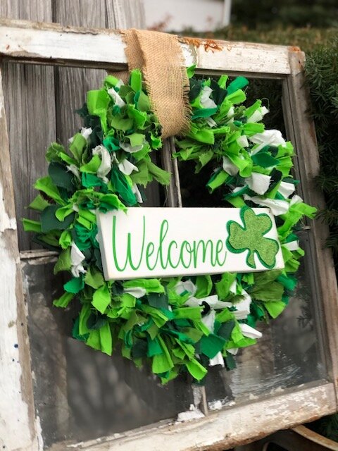 DIY Dollar Tree rag wreath for St. Patrick's Day. How to make an easy rag wreath using a Dollar Tree wire wreath form and scraps of fabric or fat quarters.