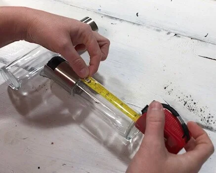 DIY labeled reusable oil spray bottles. How to make your own pam spray bottles for vegetable and olive oil for the kitchen. Plus a FREE svg file to download. Great small project to use for Cricut. Labeling kitchen with vinyl.