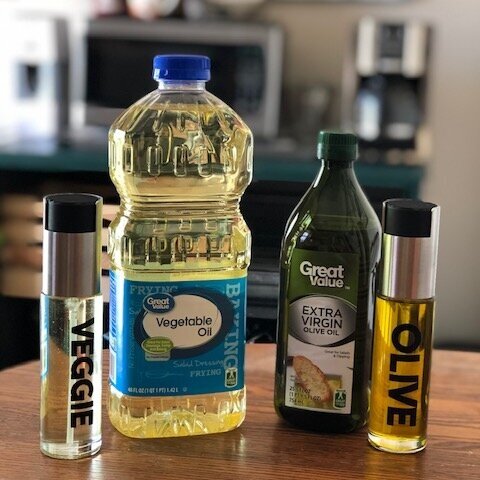 DIY labeled reusable oil spray bottles. How to make your own pam spray bottles for vegetable and olive oil for the kitchen. Plus a FREE svg file to download. Great small project to use for Cricut. Labeling kitchen with vinyl.