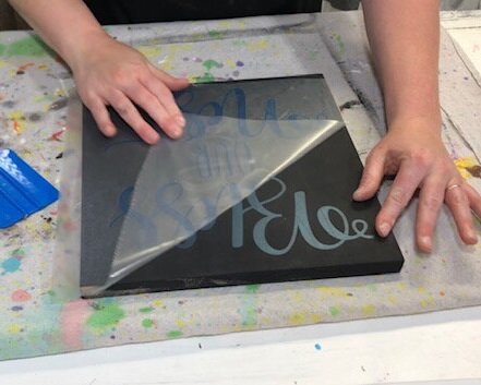 DIY sign painting tutorial. How to make a reverse stenciled sign. Painting a wood sign with no paint bleed, paint peel up, crisp lines.