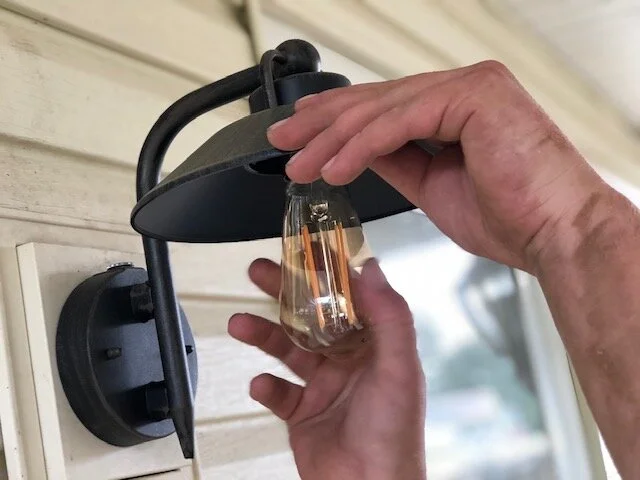 DIY porch light makeover. How to replace outdated and ugly porch fixtures on a budget.