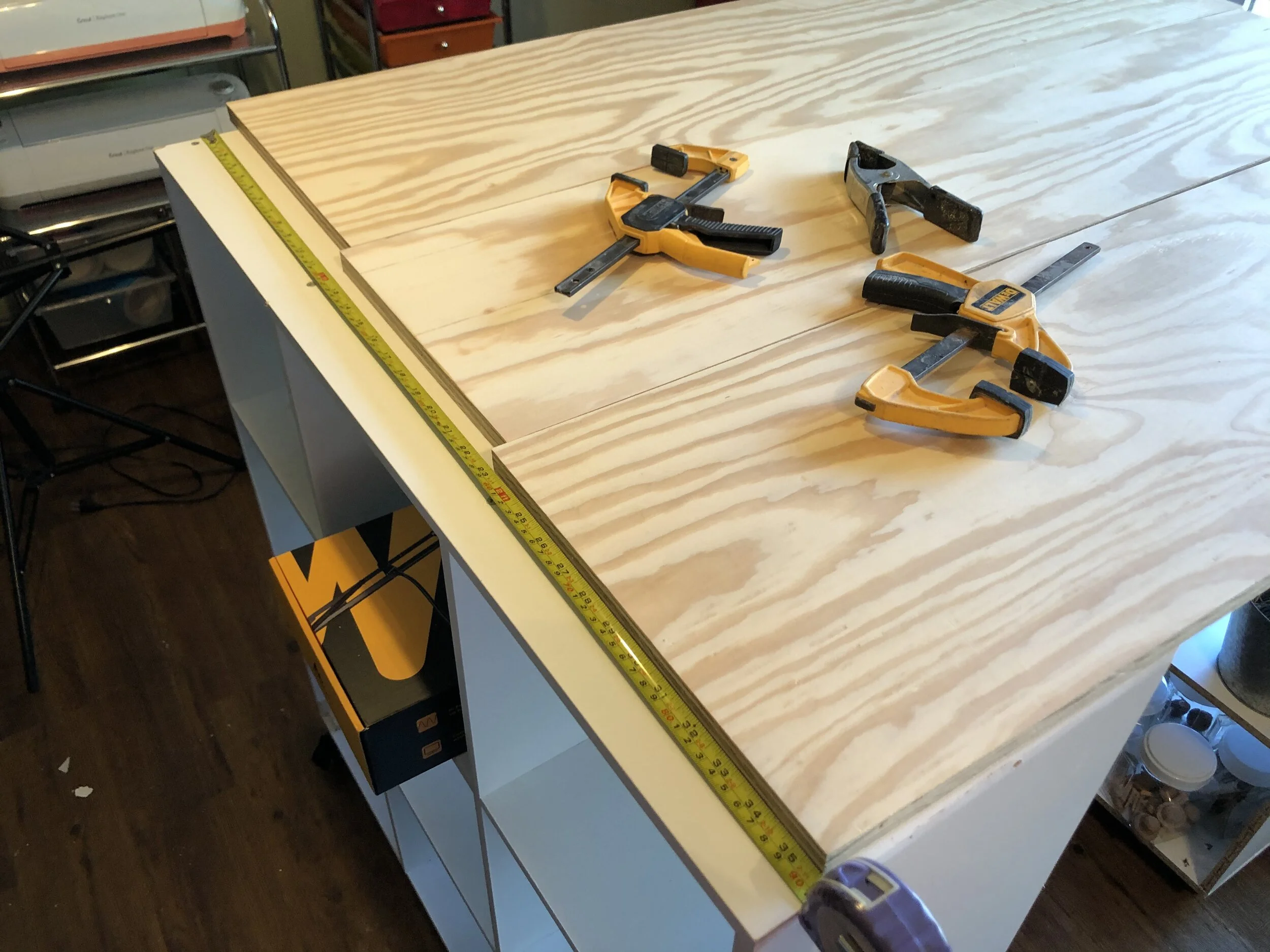 How to make a rolling craft desk on a budget. DIY Amazon 9 cube organizer standing tall craft desk. Non ikea craft desk craft.