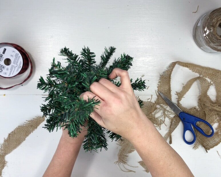 DIY Dollar Tree farmhouse Christmas tree. What to do with the mini Christmas trees from the dollar tree. Easy way to use the cheap Christmas trees from the dollar store. Rustic farmhouse Christmas decor on a budget.