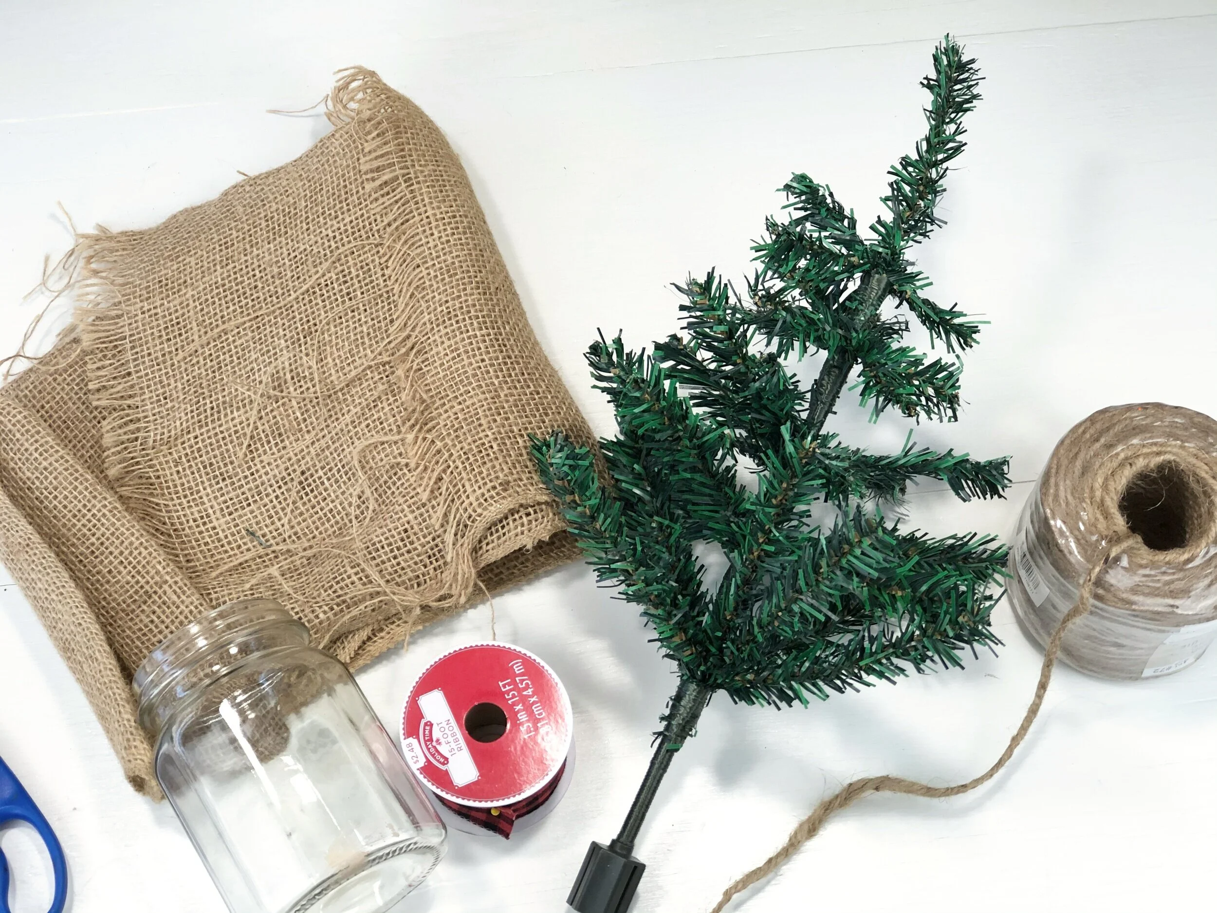 DIY Dollar Tree farmhouse Christmas tree. What to do with the mini Christmas trees from the dollar tree. Easy way to use the cheap Christmas trees from the dollar store. Rustic farmhouse Christmas decor on a budget.