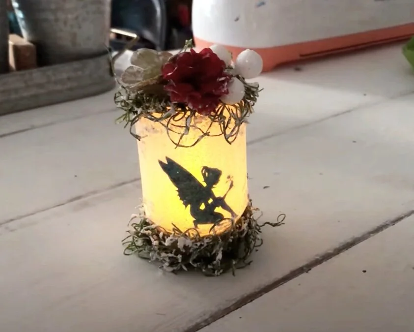 DIY glittered light up fairy jar Christmas ornament. Super cute Dollar Tree Christmas ornament DIY craft tutorial for the holiday season. How to make inexpensive Christmas ornaments the kids will love. Pretty make your own Christmas tree ornament cr…