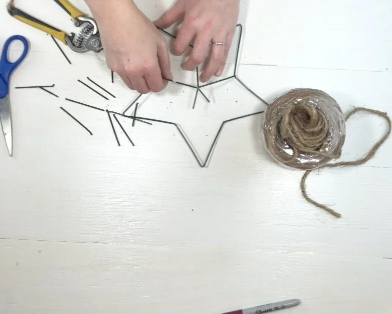 DIY dollar store Christmas decor. Christmas decorations on a budget. How to make a rustic farmhouse style star using twine or just and a wire star form.