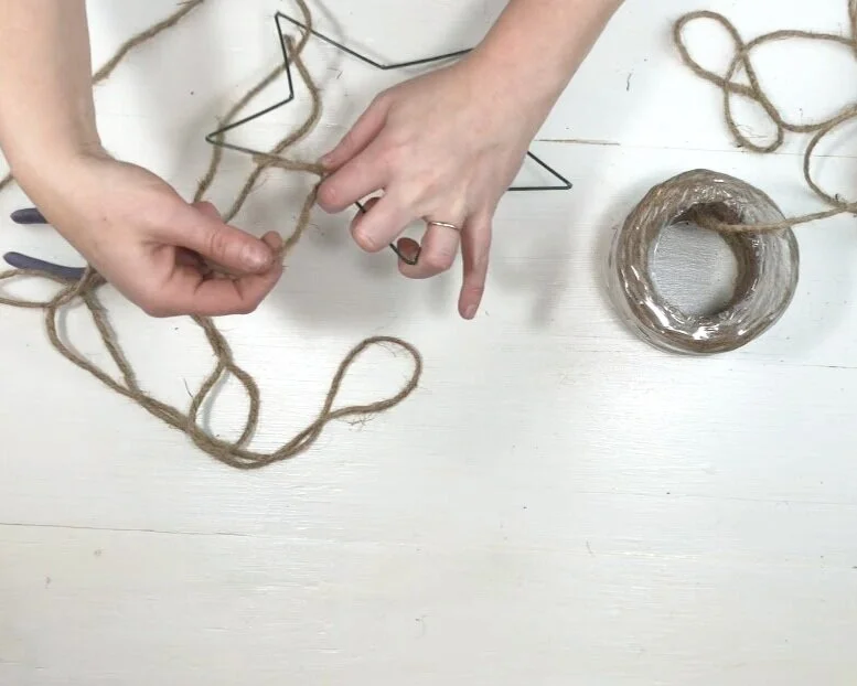 DIY dollar store Christmas decor. Christmas decorations on a budget. How to make a rustic farmhouse style star using twine or just and a wire star form.