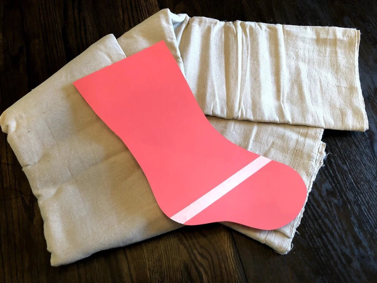 How to have a stress free stocking party with your kids. Make cute Christmas stockings out of drop cloths. DIY Christmas stockings plus a free sock stocking SVG to use with your Cricut.