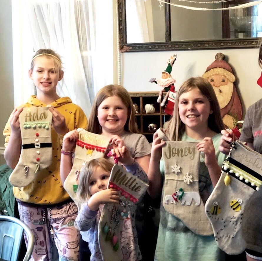 How to have a stress free stocking party with your kids. Make cute Christmas stockings out of drop cloths. DIY Christmas stockings plus a free sock stocking SVG to use with your Cricut.