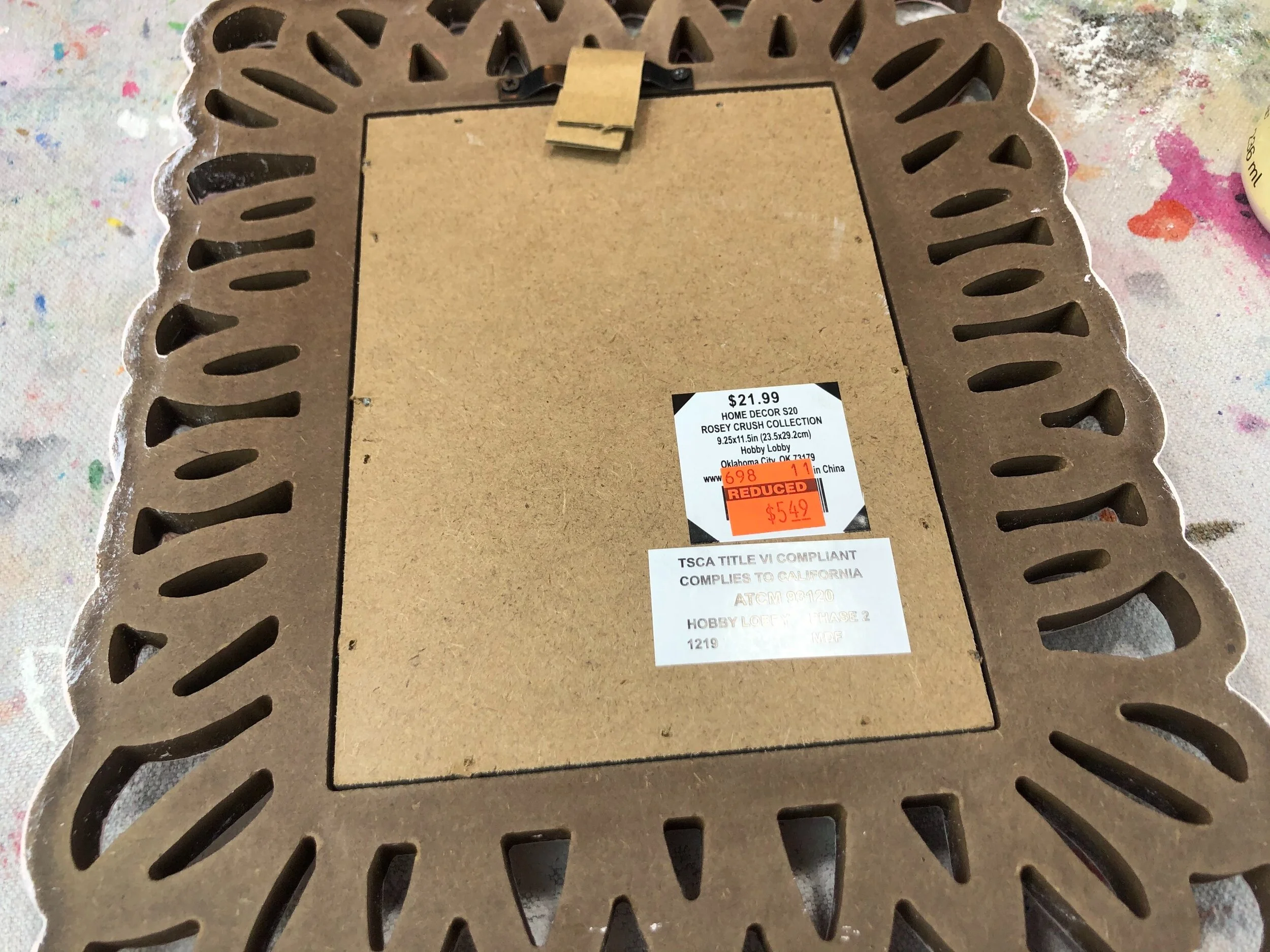 DIY Hobby Lobby clearance picture frame makeover. How to use Dollar Tree office clips to makeover an old picture frame.