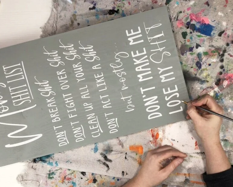 How to stencil on wood using your Cricut. DIY mom's shit list wood sign free SVG. How to paint a lettered wood sign step by step tutorial with pictures.