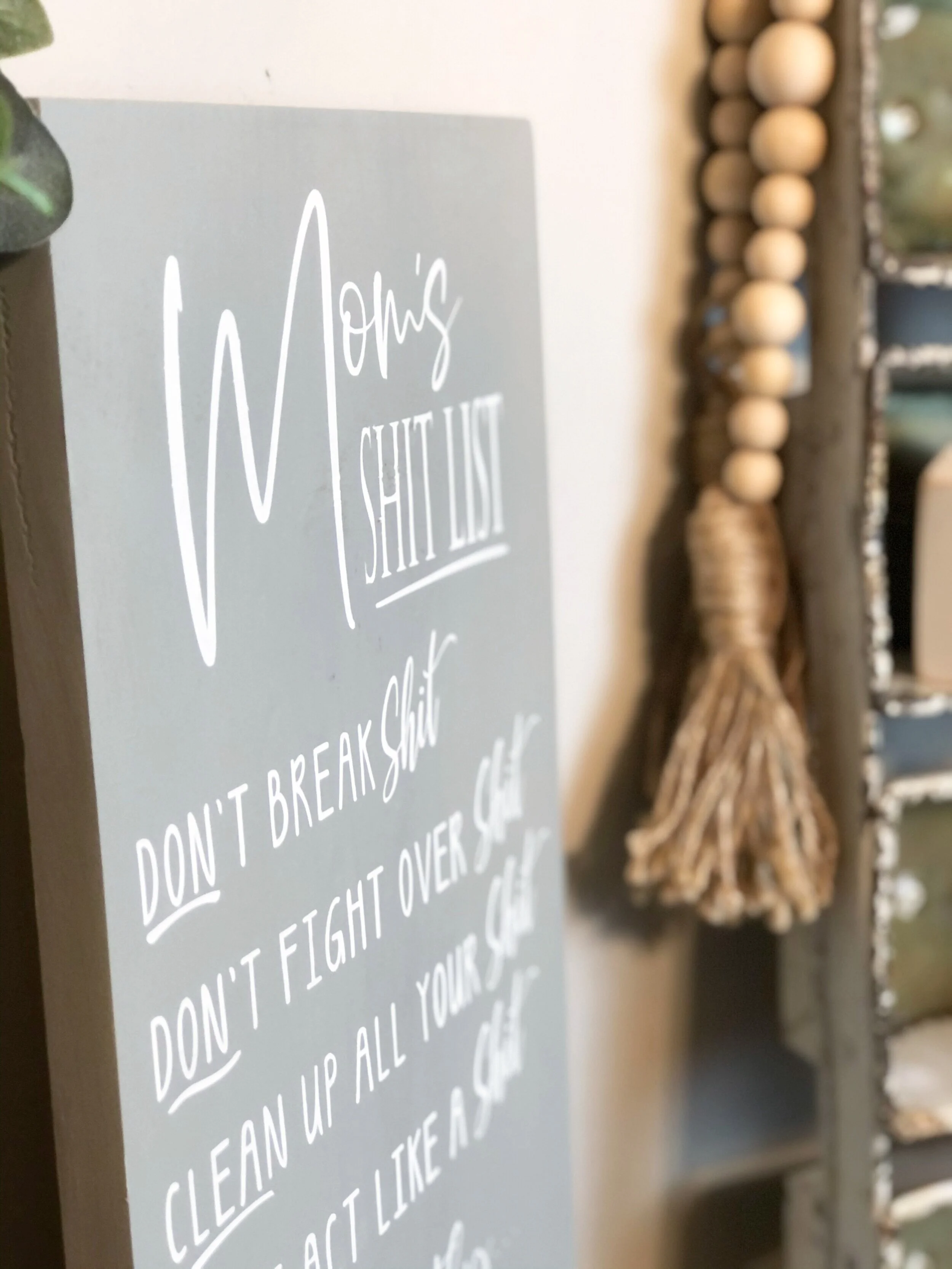 How to stencil on wood using your Cricut. DIY mom's shit list wood sign free SVG. How to paint a lettered wood sign step by step tutorial with pictures.