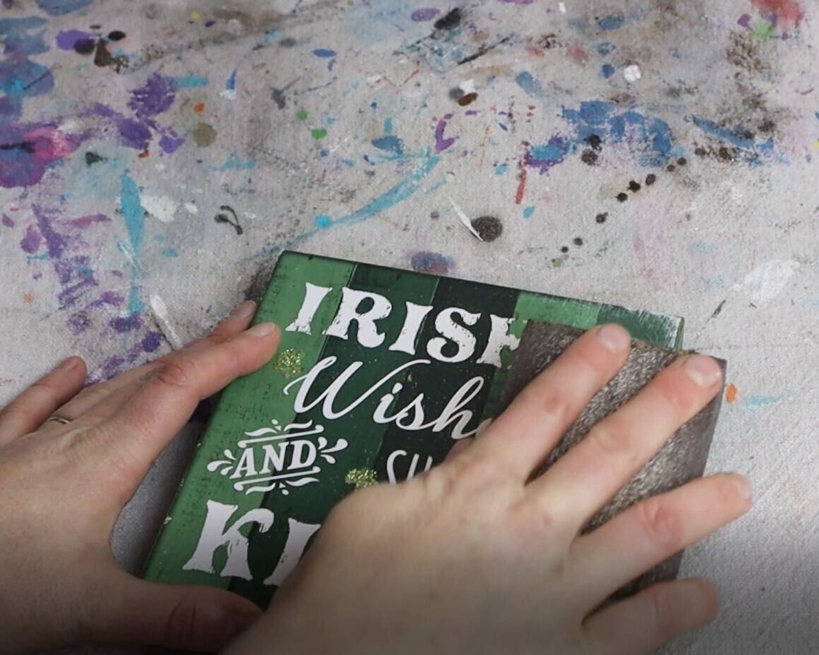 sanding glitter off of a dollar tree square sign