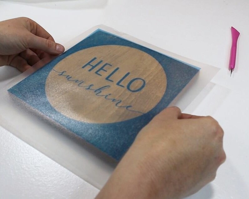 DIY how to stencil on wood sign painting tutorial. How to make a hello sunshine lettered sign for summer. Using oramask stencil film to paint wood signs without paint bleed. free svg to use with cricut for sign making.