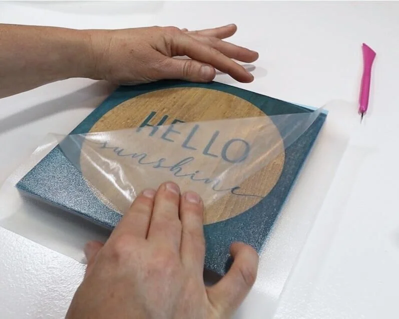 DIY how to stencil on wood sign painting tutorial. How to make a hello sunshine lettered sign for summer. Using oramask stencil film to paint wood signs without paint bleed. free svg to use with cricut for sign making.