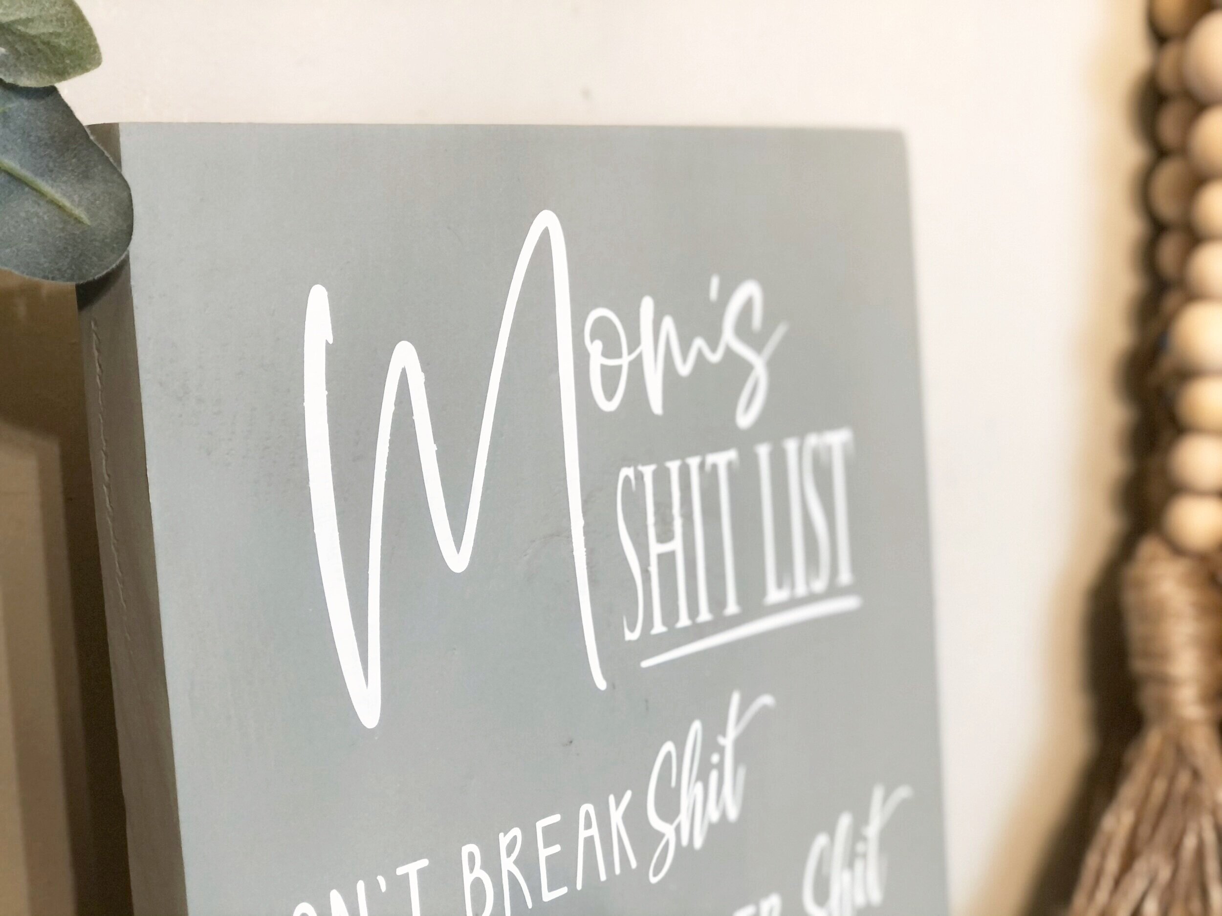 How to stencil on wood using your Cricut. DIY mom's shit list wood sign free SVG. How to paint a lettered wood sign step by step tutorial with pictures.