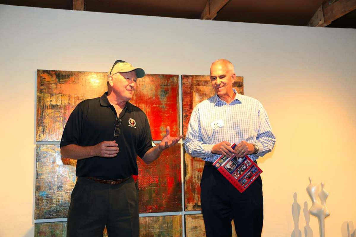  Bob Jenkins and Kirk Tushaus speaking at Jon Mirmelli's client appreciation event following the golf tournament 