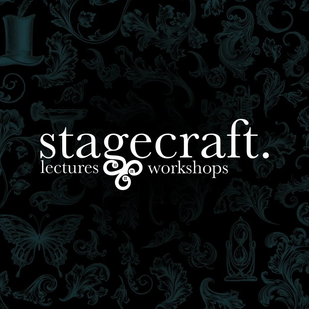 Black background with ornate blue floral and nature designs, featuring the white text 'stagecraft. lectures workshops' with a decorative button graphic.