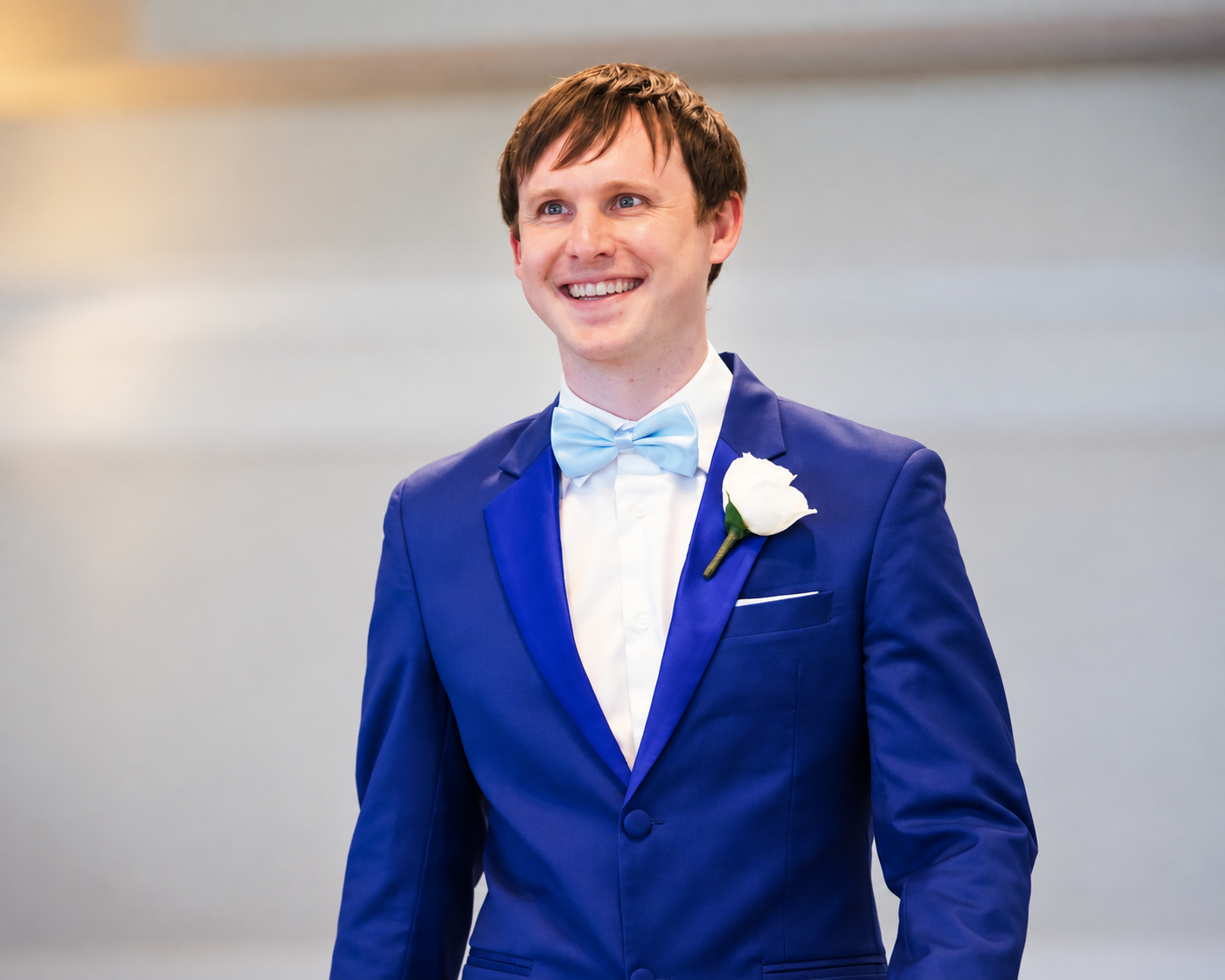 oseph Schmitt wearing a blue suit and bow tie.