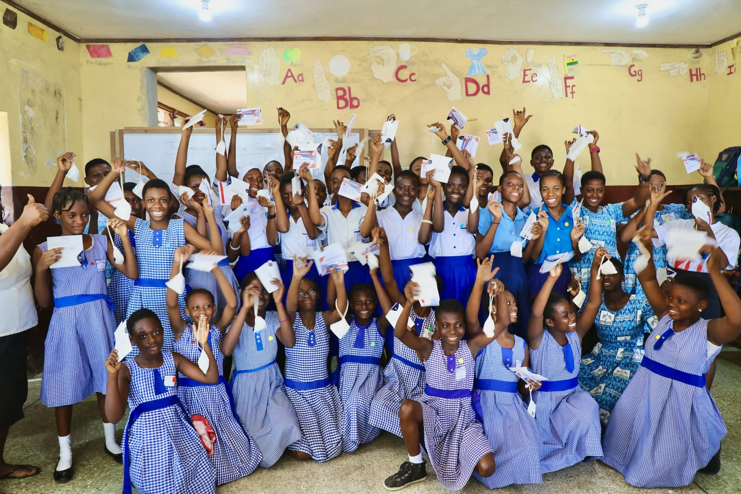 A group of students celebrating after receiving support