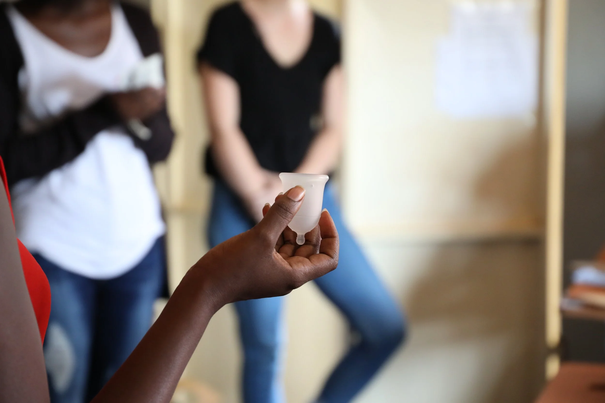 A Cova Project participant holding a menstrual cup