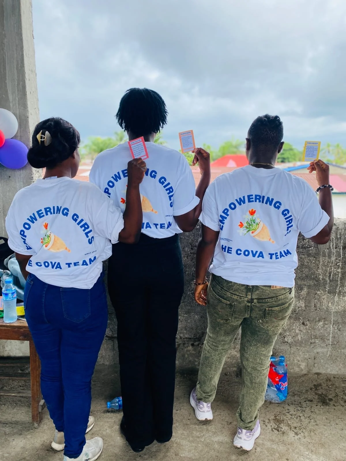 Members of the Cova team wearing Empowering Girls shirts