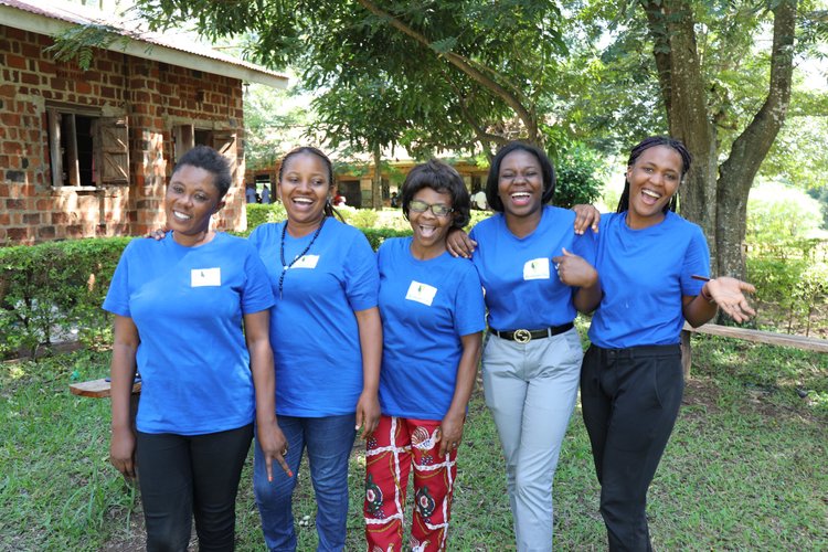 We Empower Her team in matching blue shirts in Uganda
