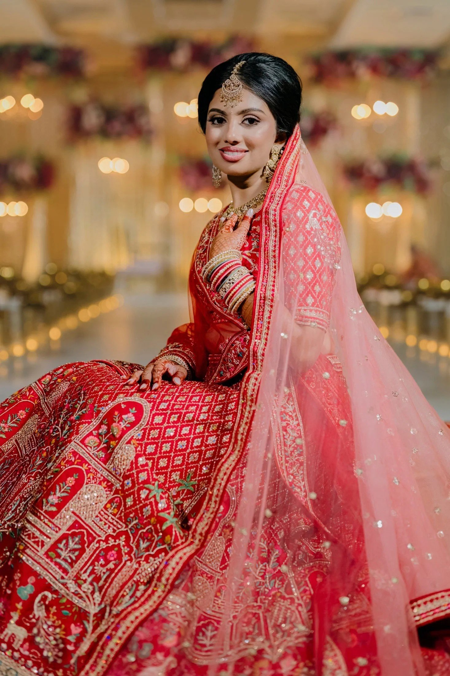 South Asian bride in red bridal lehenga styled by Red Lotus Artistry