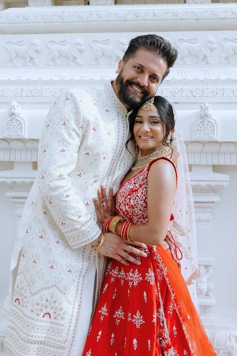 Bride and groom at a temple wedding, bridal styling by Red Lotus Artistry
