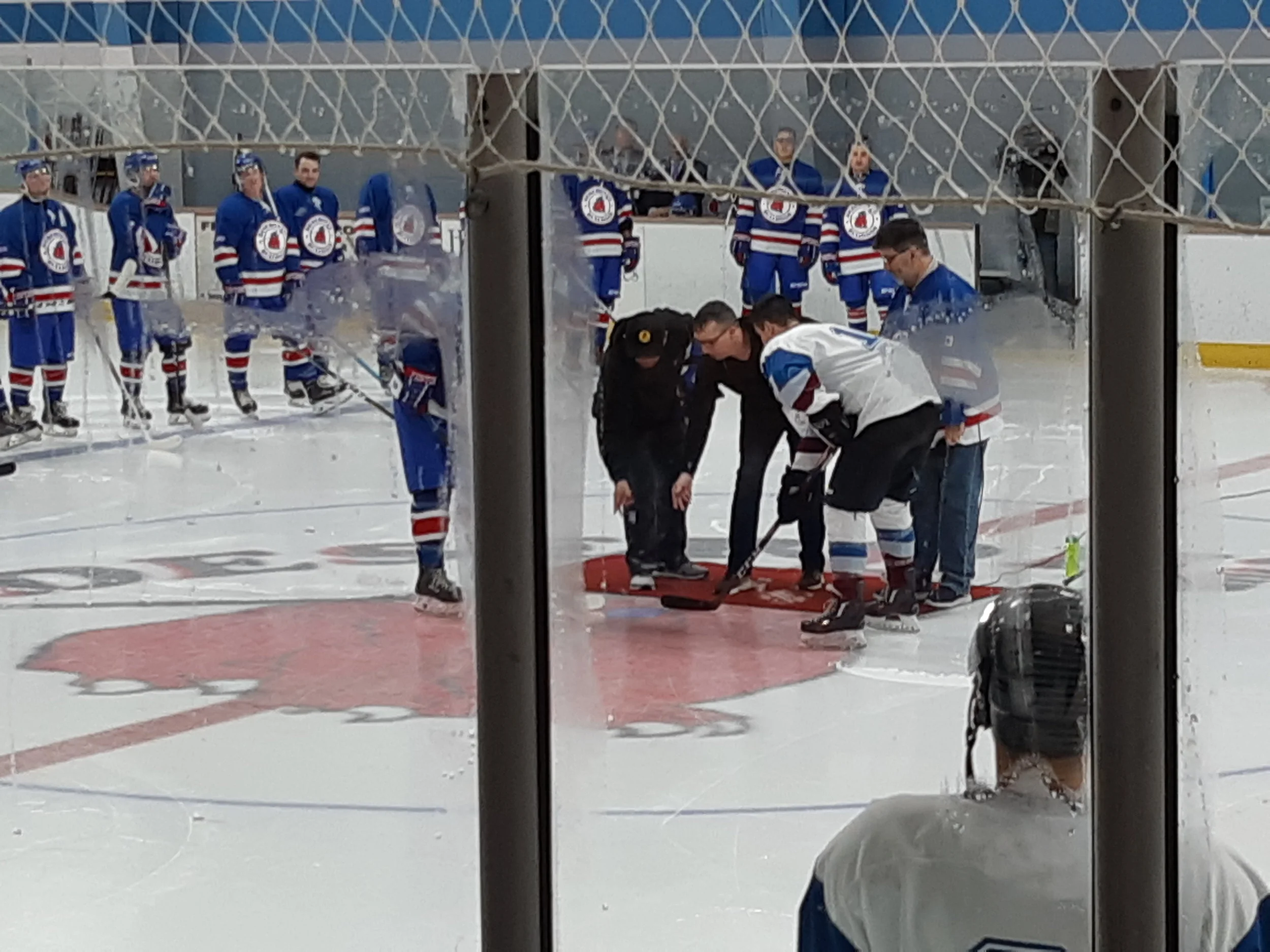 Mayor Dan Johnston at centre ice, drops puck at Deseronto Senior ‘A” hockey home opener. With (l) Bob Greenwood, Team Sponsor, and (r-standing), Richard Crouse, Bulldogs Game M.C. and Announcer.