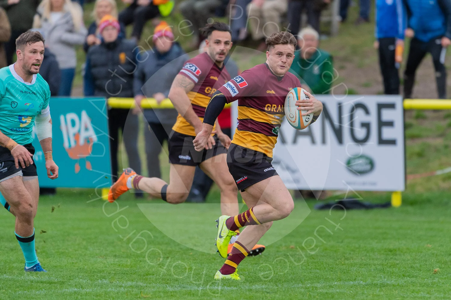 Sam Hanks intercepts a pass and takes off down the pitch (Photo: Iain Frankish, Actuance Photography)