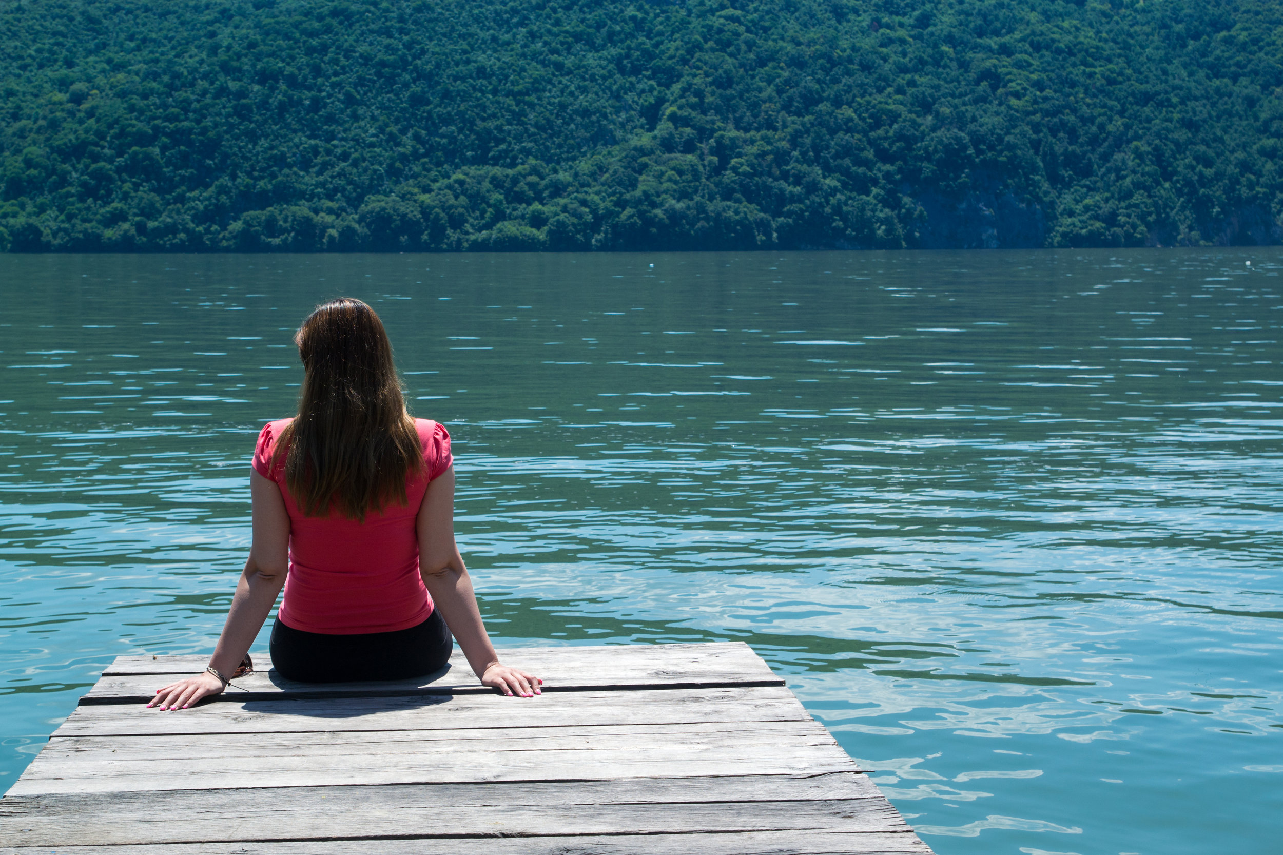 A young woman in red blouse sitting on a pontoon..jpg