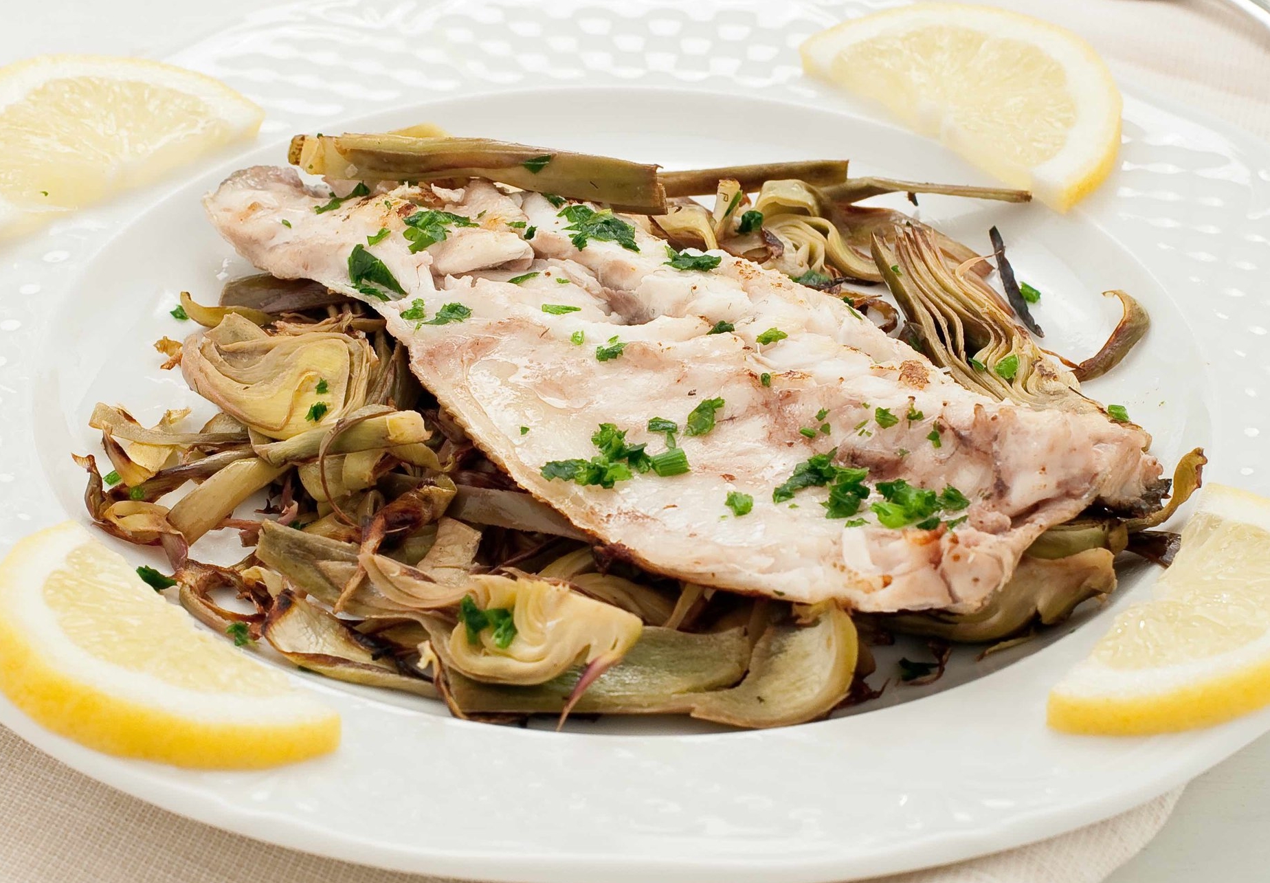 Fish sea bass cooked in a pan with the artichokes copy.jpg