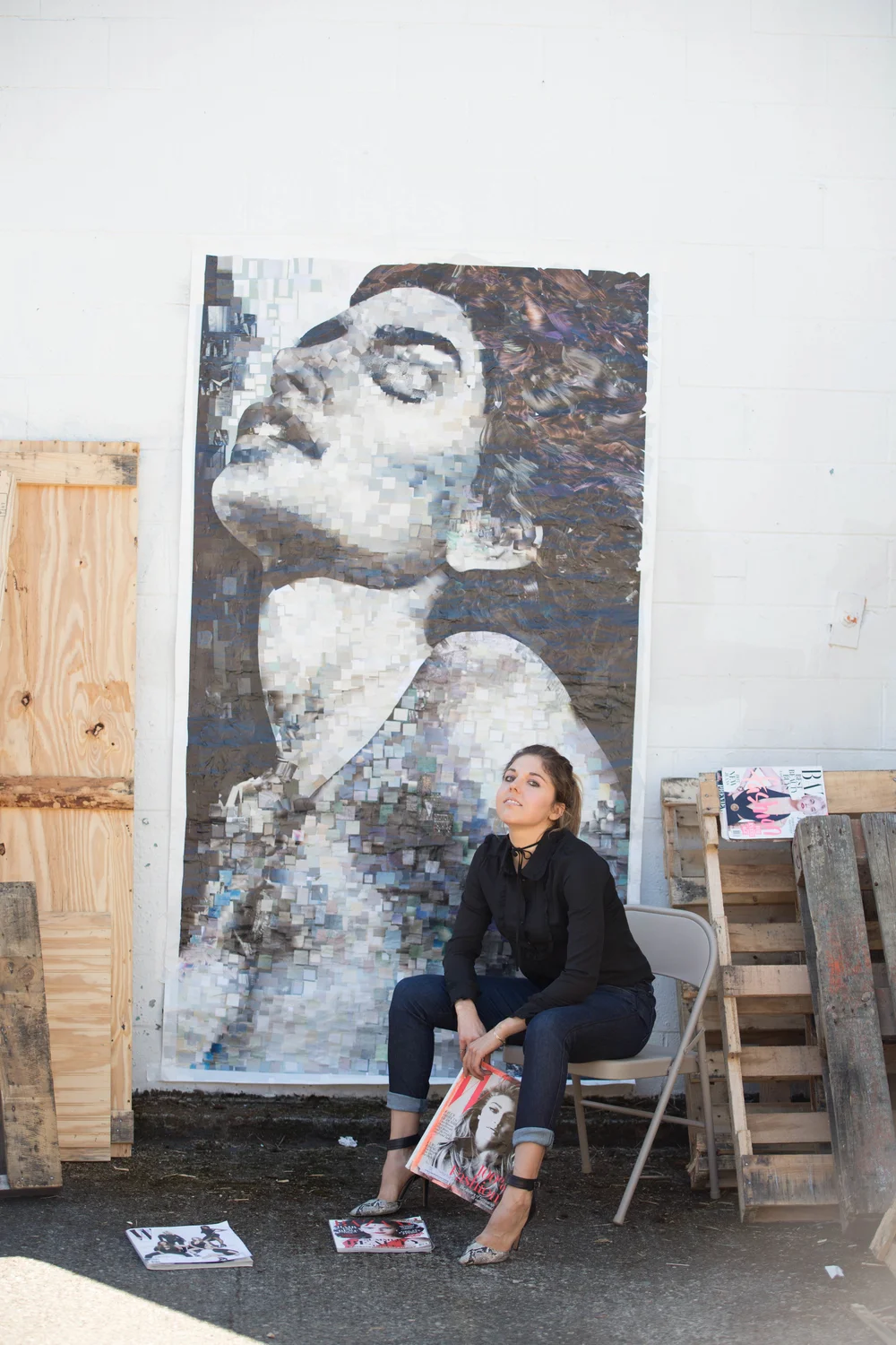 Whitney L Anderson in the studio with a large collage