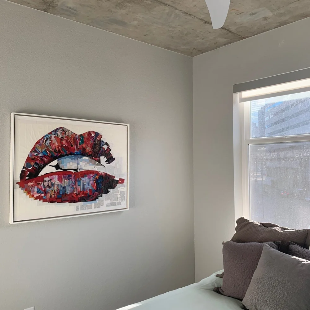 Framed Read My Lips collage in a bedroom