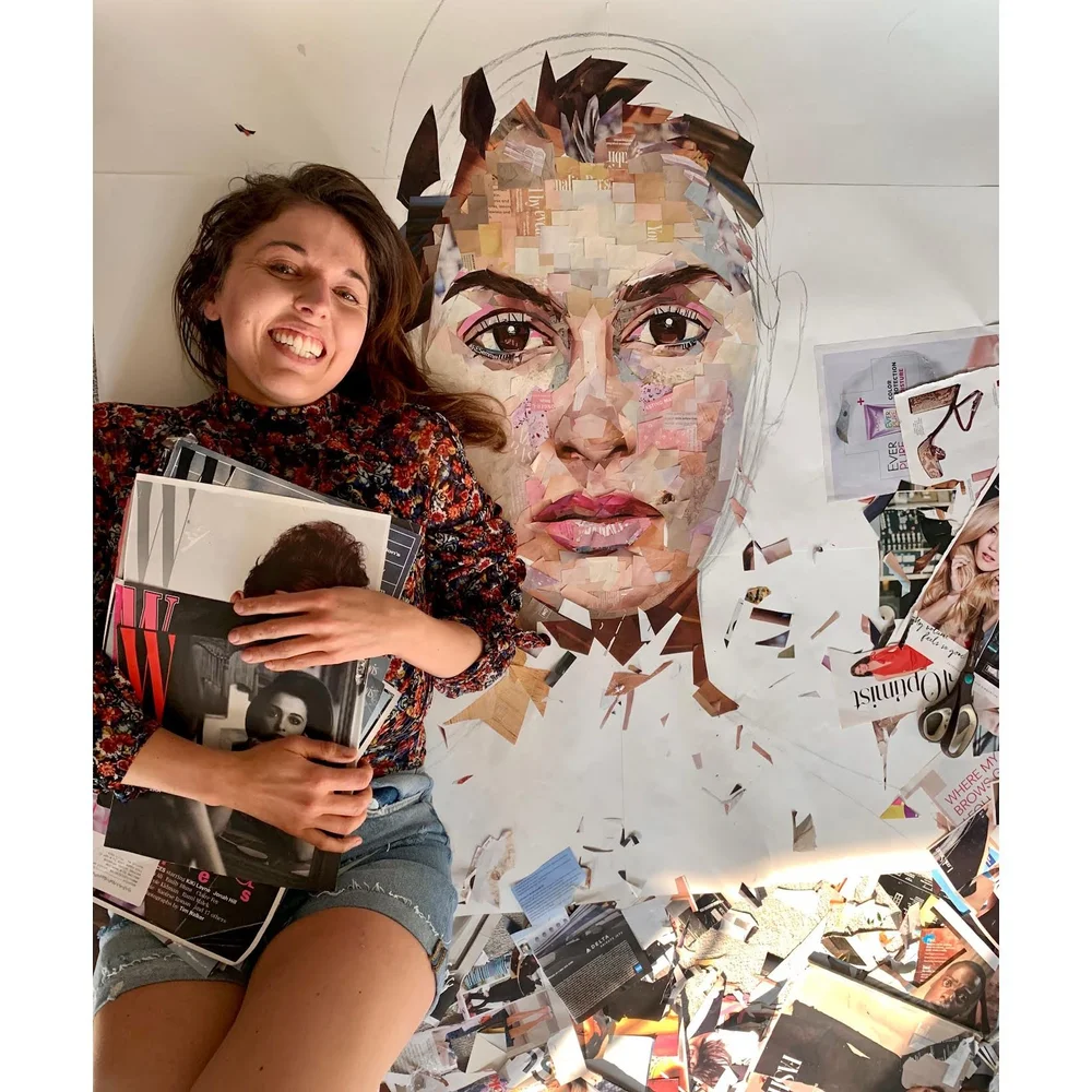 Whitney L Anderson holding magazines in front of a collage