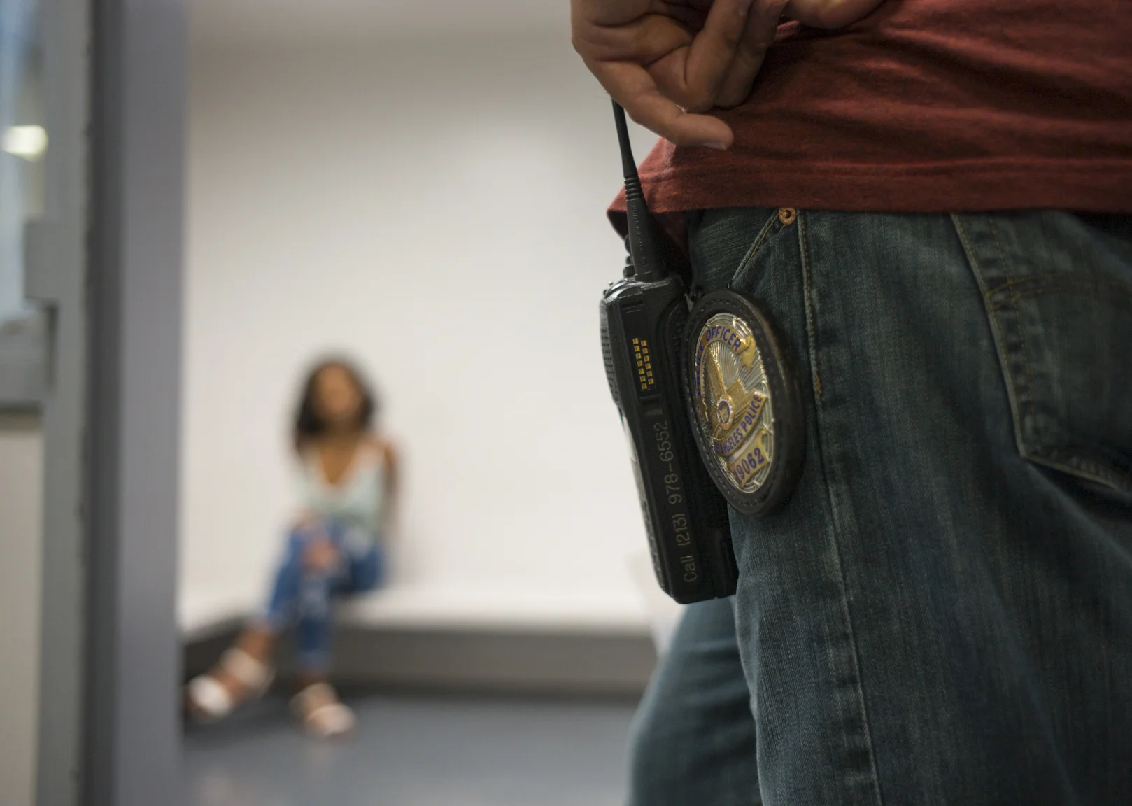 May 16, 2017: An officer of the Los Angeles Police Department's vice squad, right, monitors a 17-year old woman before she's transported to a state agency for minors following her arrest in the south east area of Los Angeles, California. The under-age woman was arrested for soliciting an undercover police officer for the purpose of prostitution, a misdemeanor charge.