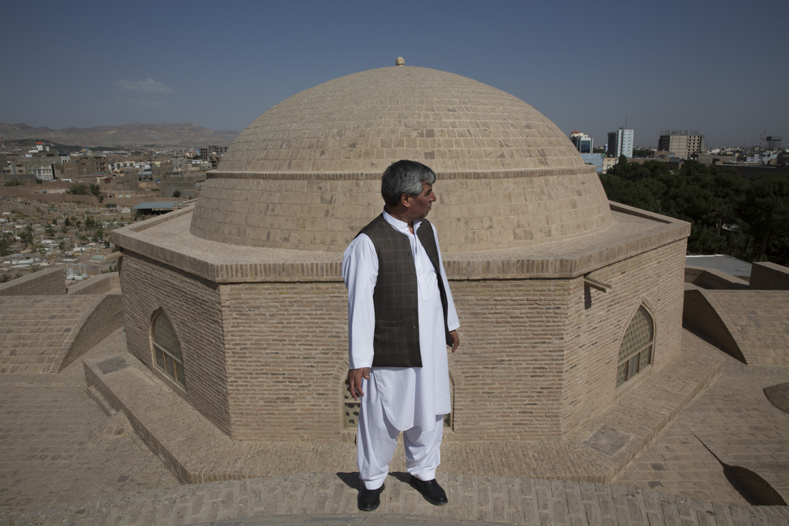 Project Engineer Habib Noori gazes out from the rooftop of Shahzada Abdullah’s west iwan , whose dome underwent extensive repairs and stabilization during restoration.