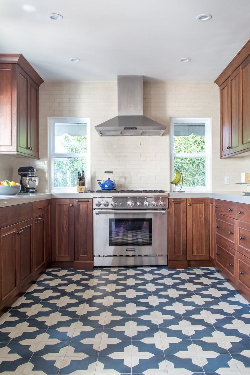  Kitchen backsplash made of 2x8 field tile in Bone / Satin with counter to ceiling installation and wrapped edge detail at the window 