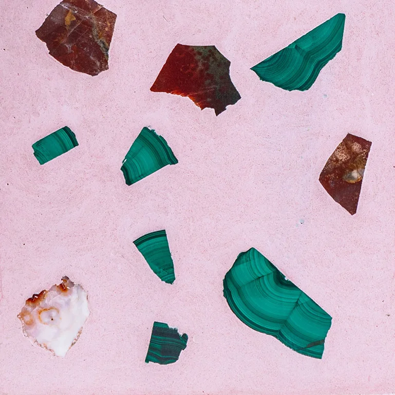 003 ELARA PINK Creamy pink field color with restrained gemstone palette including malachite, carnelian, green amethyst, and red jasper.