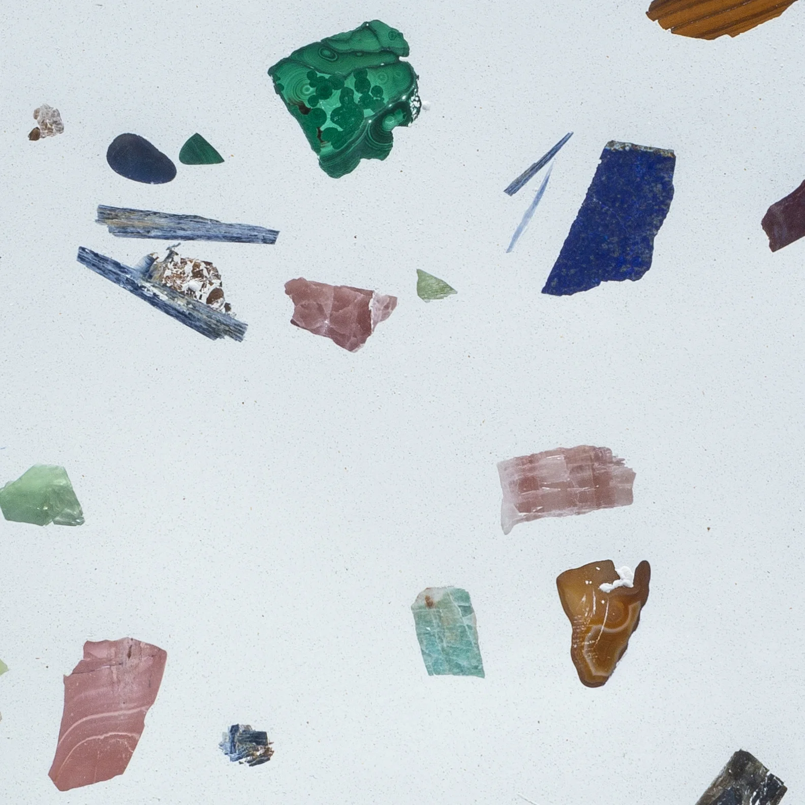 001 SUPERNOVA WHITE Creamy white field color with high contrast palette of gemstones including: amazonite, amethyst, blue lace agate, blue opal, carnelian, flourite, labradorite, lapis, jasper, malachite, pink opal, rose quartz and tigers eye.