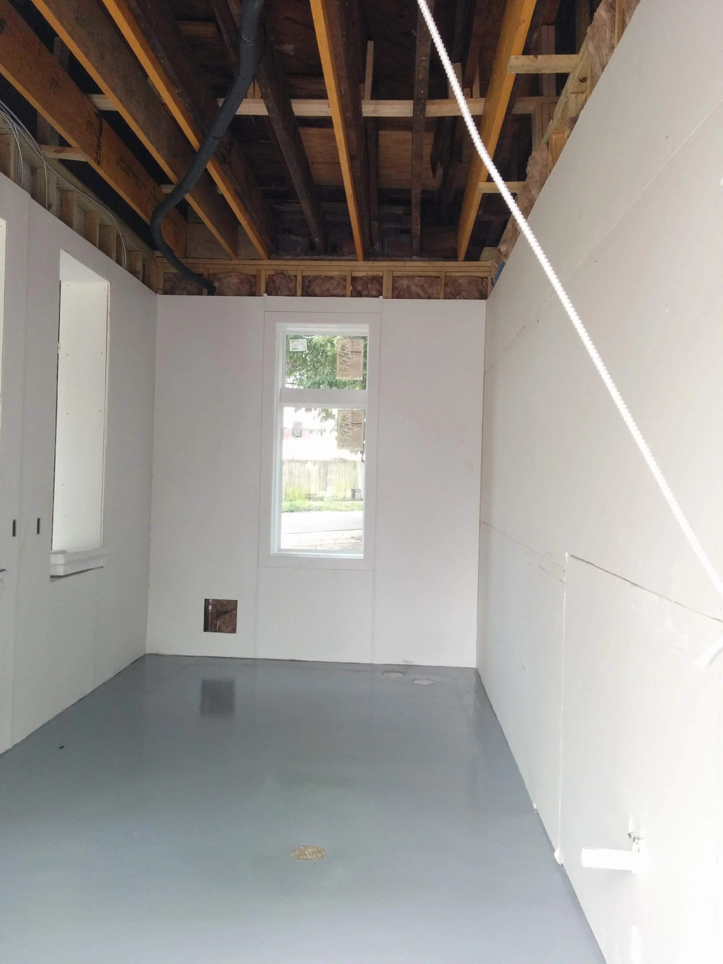 So bright! Where the hood and pizza ovens will go in the back “office” of the old gas station.