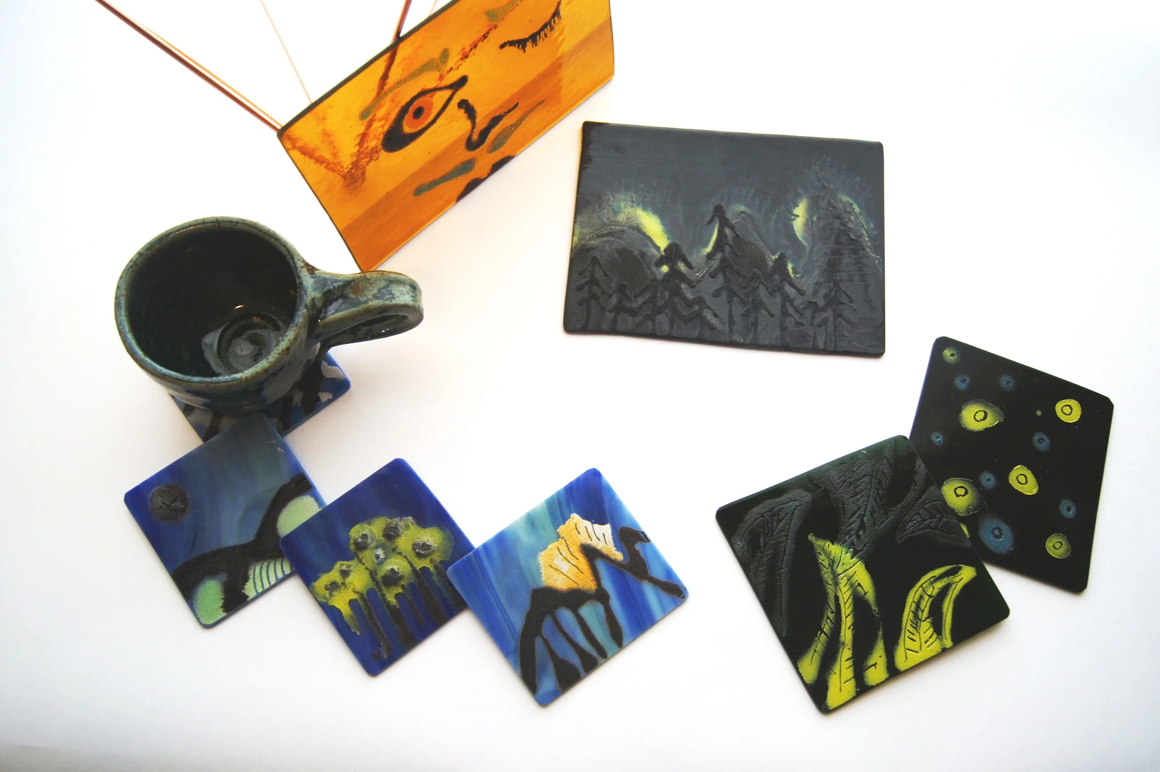 In this 2 Hour workshop, you will get to choose to paint on a set of 4 coasters or One 6” x 4” panel of glass to hang on your window or wall! It is a great time to get to get to know certain compositions of glass and how the process of glass works. Plus once its fired in the kiln, you get to take home this awesome hardcore medium and show it off to your family and friends. Or make it a gift for someone special. More details coming soon! Stay tuned!