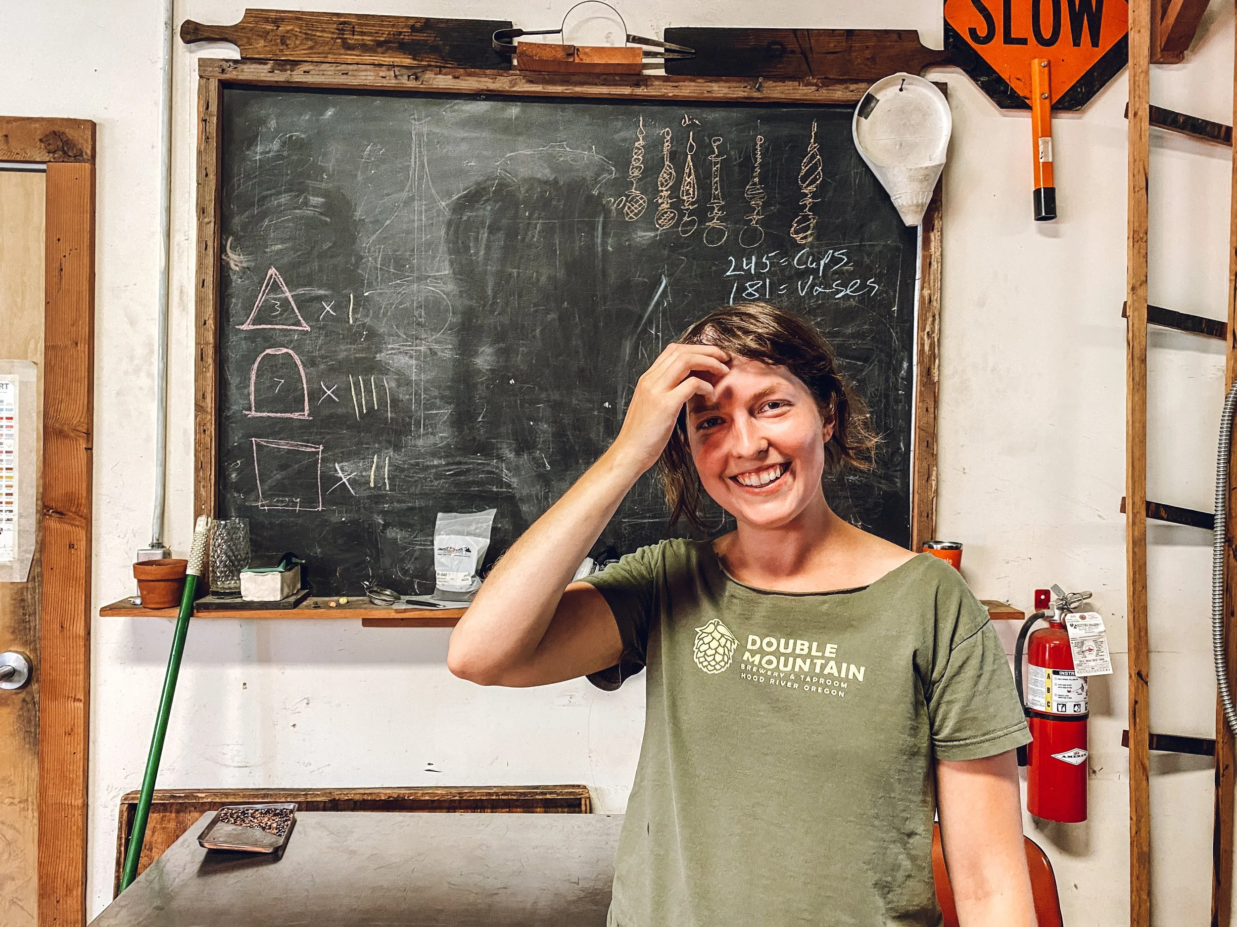 Rachel and Studio Chalkboard.JPG