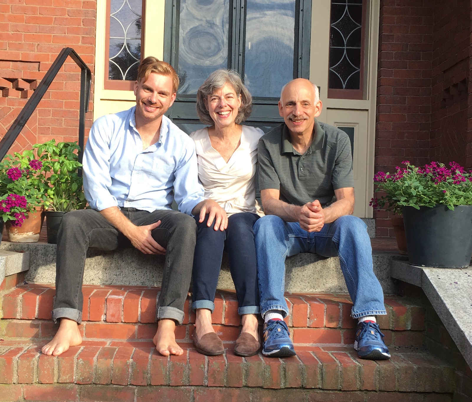 Hanging with mom and dad on the front steps, post op hair style in full effect
