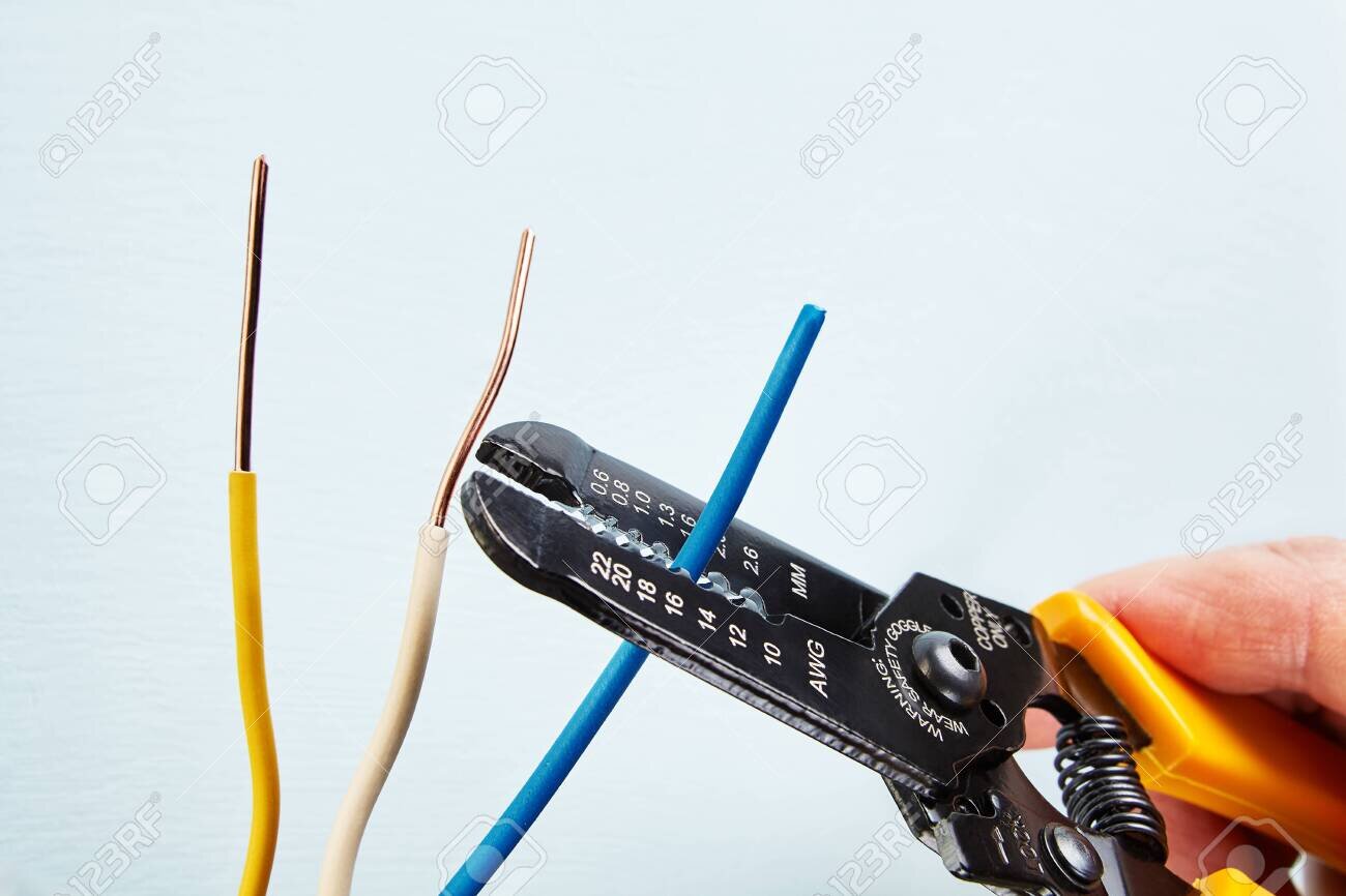 119876435-electrician-uses-wire-stripper-tool-during-electrical-wiring-services-.jpg