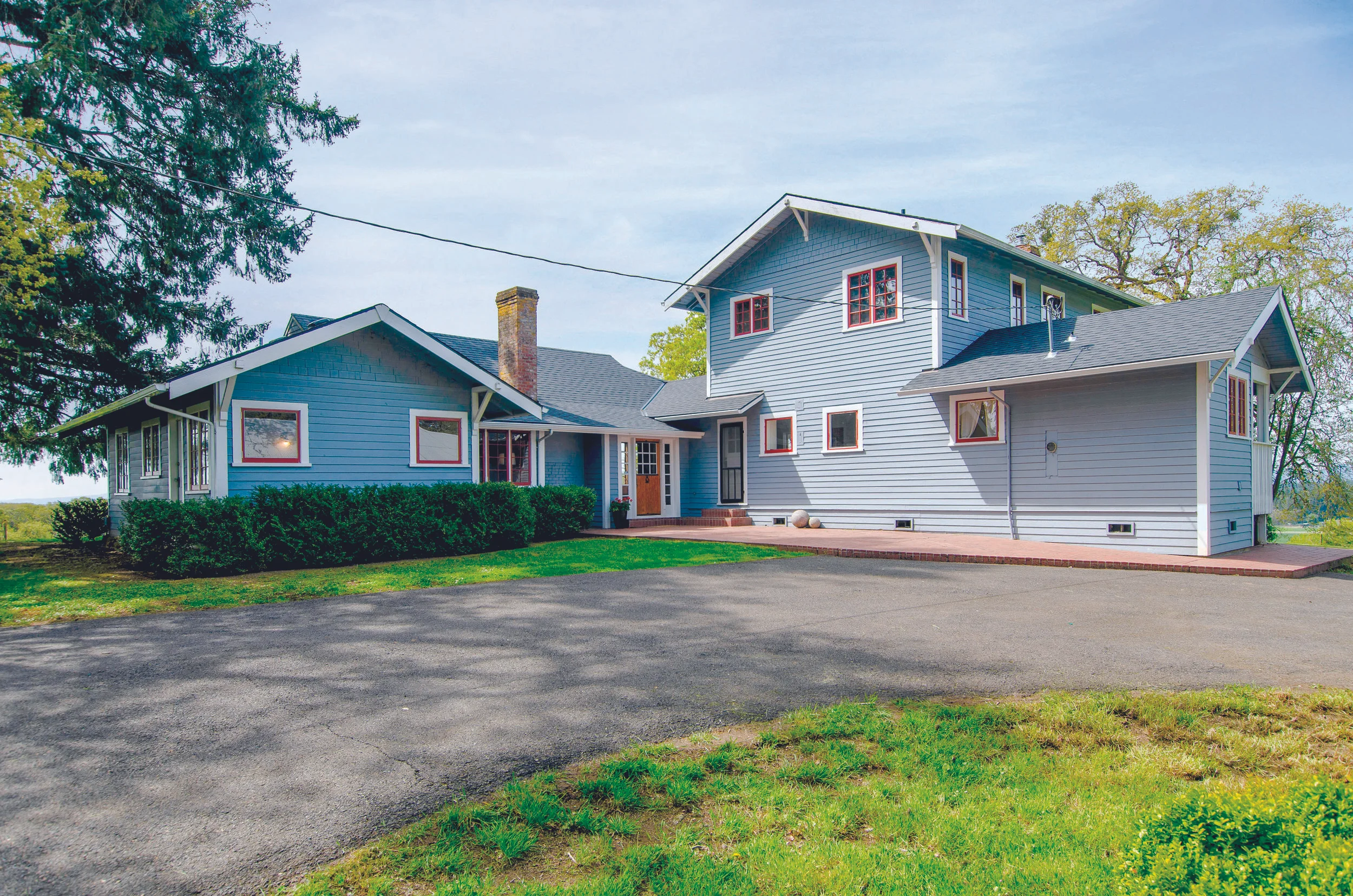 This lovingly restored and updated home is peacefully located on a knoll overlooking the vineyard.
