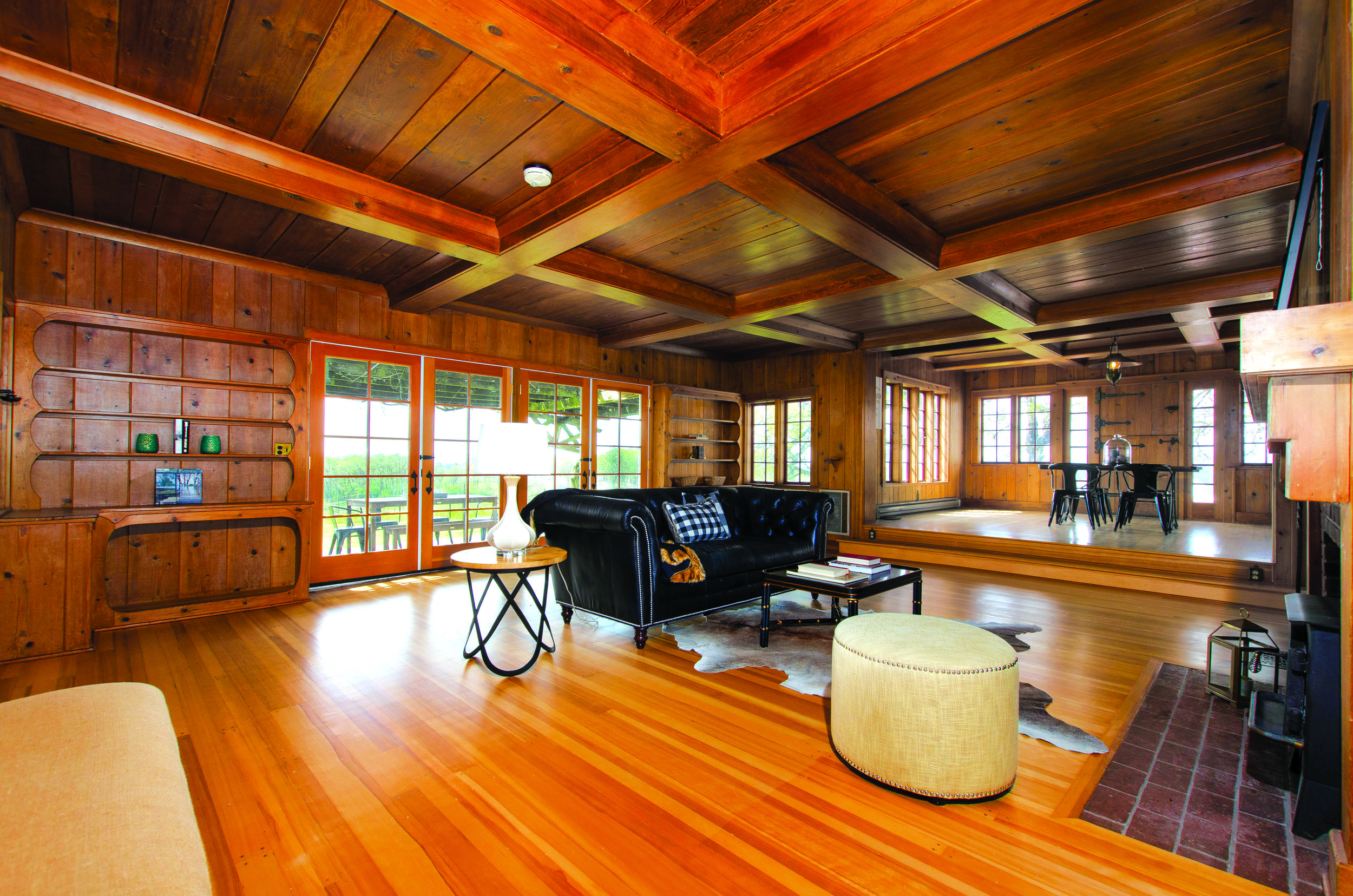 Wood floors, box beam ceilings, multiple fireplaces, handcrafted iron work and a big country kitchen set the mood, while modern luxuries facilitate easy living including Subzero refrigerator, sauna and updated bathrooms.