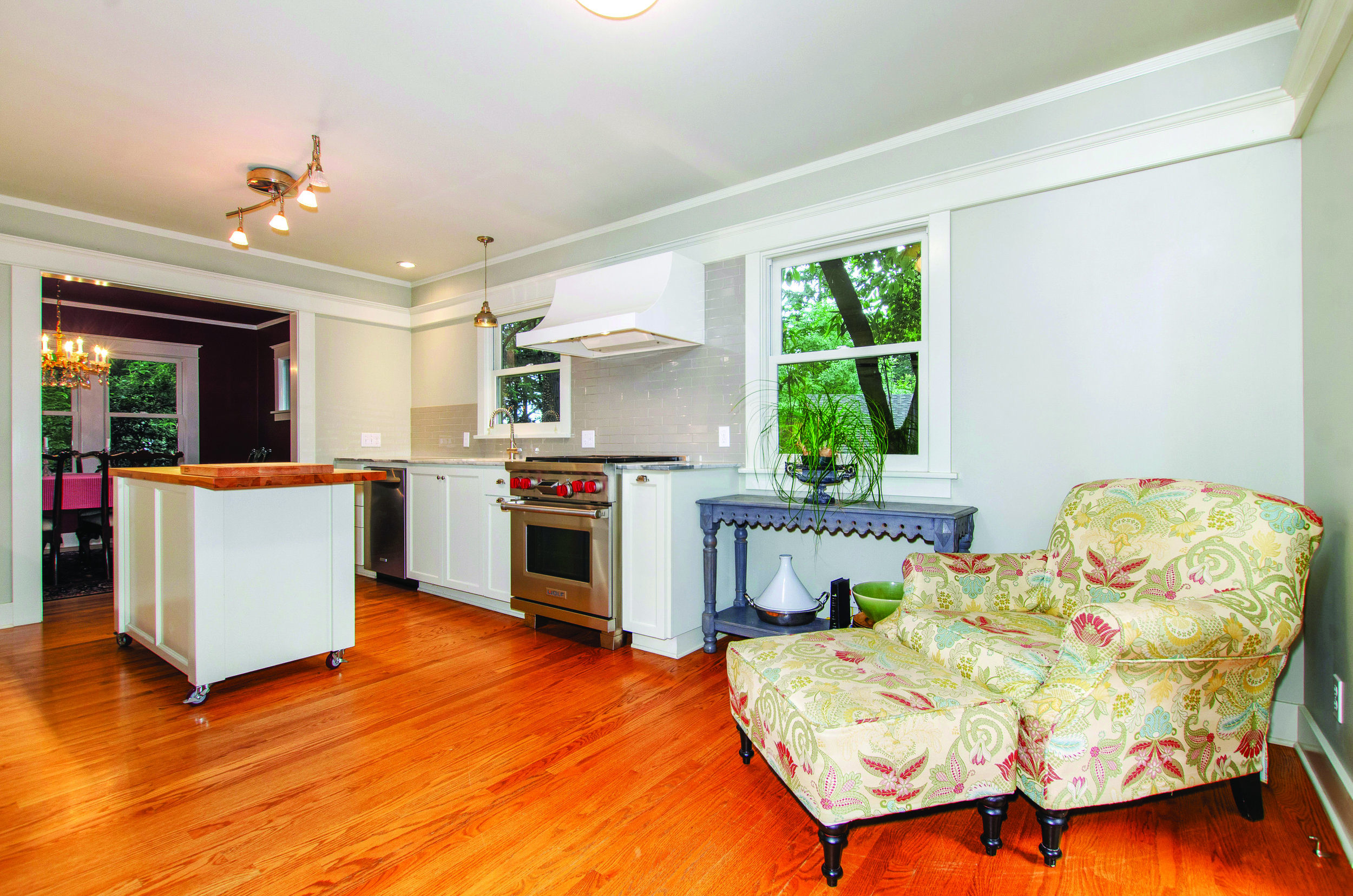 Beautifully preserved wood floors, original dining room with leaded glass built-ins, and updated chef’s kitchen showcasing a Wolf range and marble counter tops.